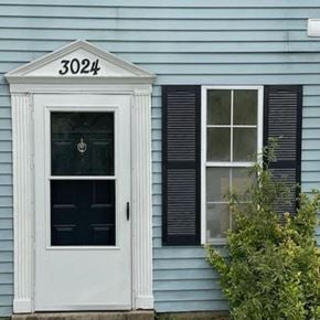 Bowie house for rent - A white door with the number 3024 above it.