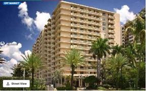 Bal Harbour apartment for rent - an image of an apartment building with palm trees