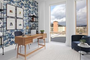 Portland apartment for rent - A room with a desk, a chair, and a wall with pictures on it at The Fitz Apartments, Portland, OR