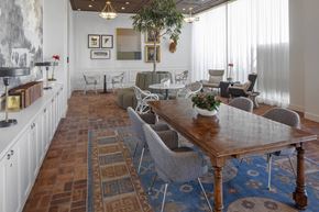 Portland apartment for rent - A dining room with a wooden table surrounded by chairs at The Fitz Apartments,Portland, Oregon