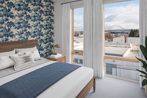 Portland apartment for rent - A bedroom with a large bed and a view of a bridge at The Fitz Apartments, Portland, OR