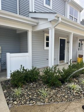 Atco apartment for rent - A house with a grey siding and a white door.