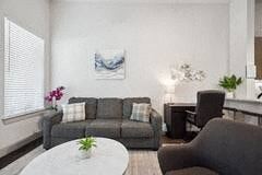 Richardson house for rent - a living room with a couch and a table