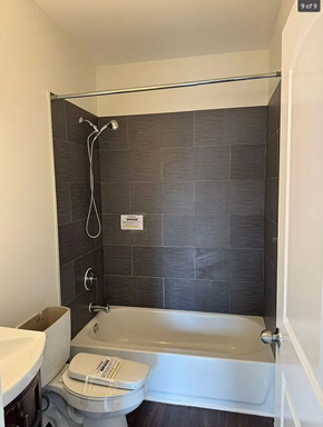 Baltimore house for rent - a bathroom with a toilet and a bath tub