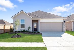 Slidell house for rent - A house with a grey roof and a white garage door.
