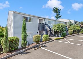 Portland apartment for rent - a kitchen with wooden cabinets and stainless steel appliances