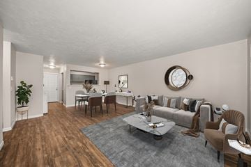 Spokane apartment for rent - a living room and dining room with a couch and a table