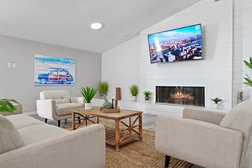 Tempe apartment for rent - a living room with a fireplace and a tv on the wall