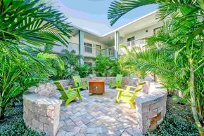 Tampa apartment for rent - A patio with a table surrounded by green plants.