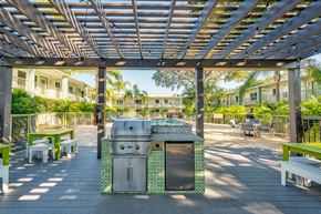 Tampa apartment for rent - A BBQ grill is in the middle of a patio.