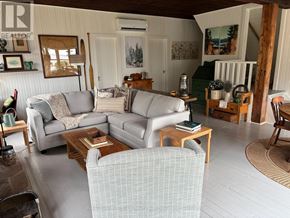 The Archipelago (Archipelago South) house for rent - the porch of a cabin with rocking chairs on it