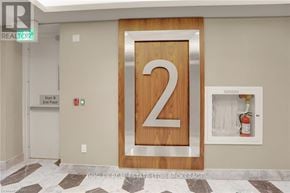 Fort Erie (Crystal Beach) condo for rent - a bathroom with a painting on the wall and a potted plant