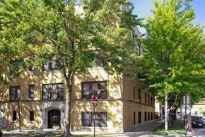 Chicago apartment for rent - a large building with trees in front of it