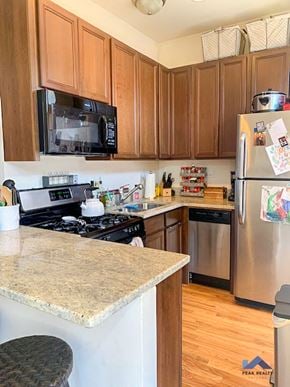 Chicago apartment for rent - a kitchen with stainless steel appliances and granite counter tops
