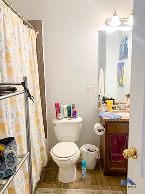 Chicago apartment for rent - a bathroom with a toilet and a shower and a sink