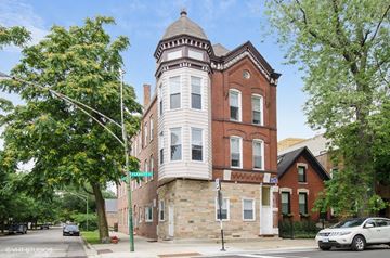 Chicago apartment for rent - a building with a tower on the corner of a street