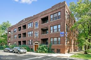 Chicago apartment for rent - a red brick apartment building on a city street