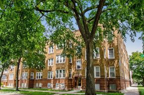 Chicago apartment for rent - a large brick building with trees in front of it