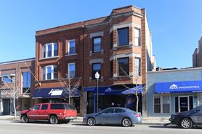 Chicago apartment for rent - a brick building on the corner of a city street