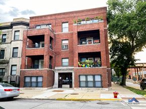 Chicago apartment for rent - a red brick apartment building on the corner of a street