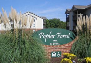 Farmville apartment for rent - a sign for the popular forest park in front of a building