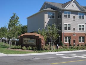 Hampton apartment for rent - a building with a sign in front of a street