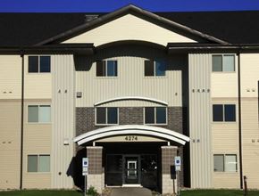 Grand Forks apartment for rent - the front of a large building with an entrance