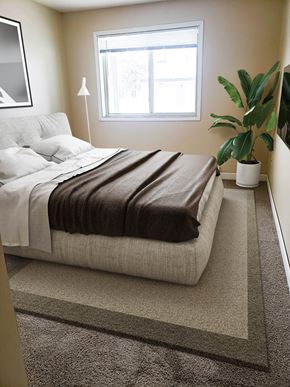 Grand Forks apartment for rent - a bedroom with a bed and a potted plant