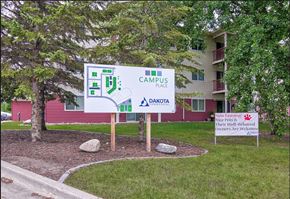 Grand Forks apartment for rent - a sign for campus place in front of a building