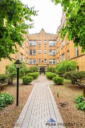 Chicago apartment for rent - a path leading to a building in a courtyard