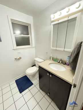 Chicago apartment for rent - a bathroom with a sink toilet and a window