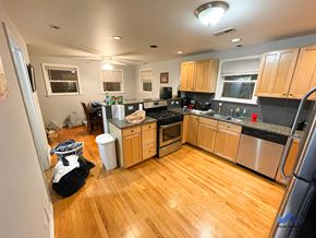 Chicago apartment for rent - a kitchen with wooden floors and stainless steel appliances