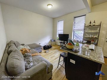 Chicago apartment for rent - a living room with a couch and a tv