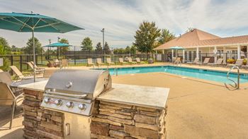 Poolside outdoor kitchen with charcoal grill