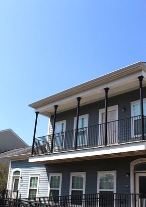 New Orleans apartment for rent - a house with a balcony and a blue sky