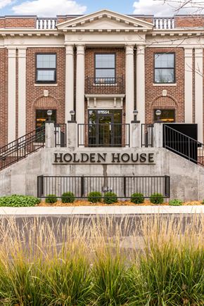 St. Paul apartment for rent - Holden House is a two-story building with a black metal railing in front.