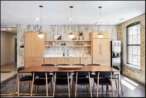 St. Paul apartment for rent - A kitchen with a table and chairs in front of a brick wall.