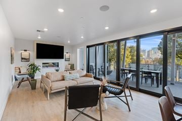 Salt Lake City apartment for rent - a living room with a couch and chairs and sliding glass doors