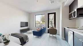 Denver apartment for rent - a living room with a couch and a tv