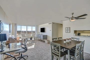 Salt Lake City apartment for rent - A living room with a dining table and chairs.