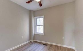 Washington house for rent - A room with a window and a ceiling fan.