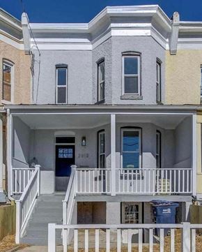 Washington house for rent - A two-story house with a blue door and white railings.