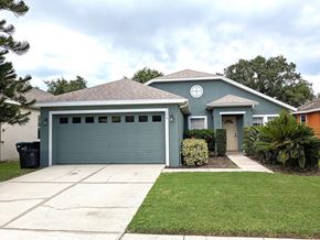 Orlando house for rent - A house with a grey roof and a white circle on it.
