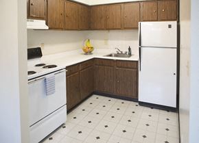 North Versailles apartment for rent - a kitchen with white appliances and wooden cabinets