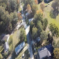 Phenix City apartment for rent - A road cuts through a residential area.
