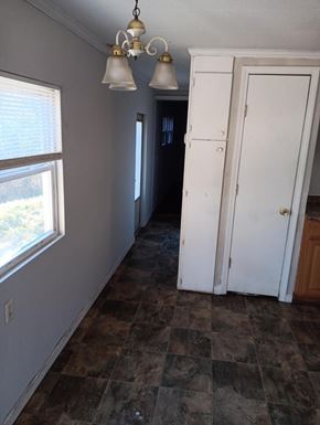 Phenix City apartment for rent - A room with a checkered floor and a white door.