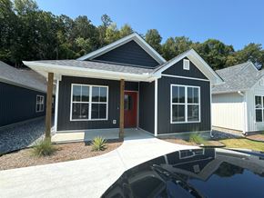Little Rock house for rent - the front of a house with a garage and a driveway