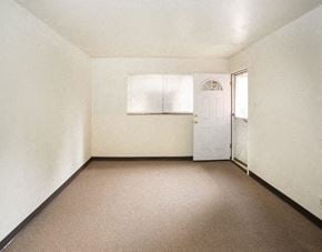 North Versailles apartment for rent - an empty room with a white door and a window