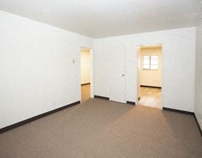 North Versailles apartment for rent - an empty living room with white walls and a carpet