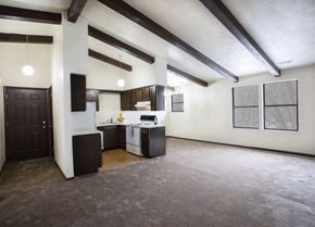 Mckeesport apartment for rent - A kitchen area with a sink, stove, and cabinets.